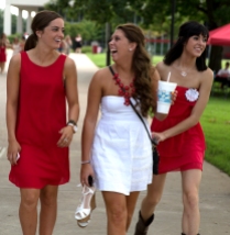 Western Kentucky University Sophomores, Caitlin Lee (19), Paige Ward (18) and Lauren U'Sellis (19) are all from Louisville Kentucky. They wear red and white to represent their school, WKU, prior to the first football game.