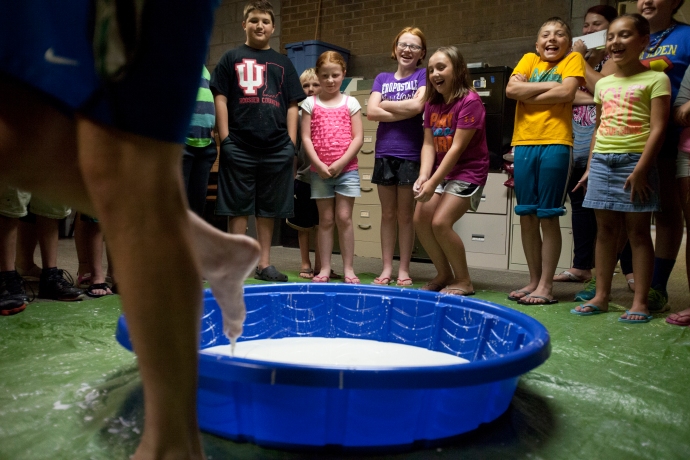 Bellarmine student and Bombers player Brady Pfaadt demonstrated how to run across the kid sized pool filled with the children's oobleck both slowly and quickly. When Pfaadt went slowly he began to sink into the substance, but when Pfaadt went quickly his feet were clean. This took place at the five-week program called STEAM! for ages 8 and older that will make science, technology, engineering, art and math fun. The oobleck activity consisted of mixing one and a half cups of cornstarch with one cup of water together. It taught the kids about the properties of oobleck because when you play with the substance slowly it is liquid, but if you play with it quickly it can turn into a solid form, similar to quicksand. They put this in a pool so kids could run across the substance like Pfaadt demonstrated.